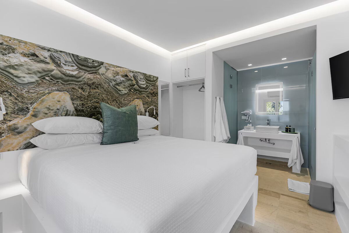 Enjoy garden views and boutique comfort in the Hephaestus Room at Villa K 🌿