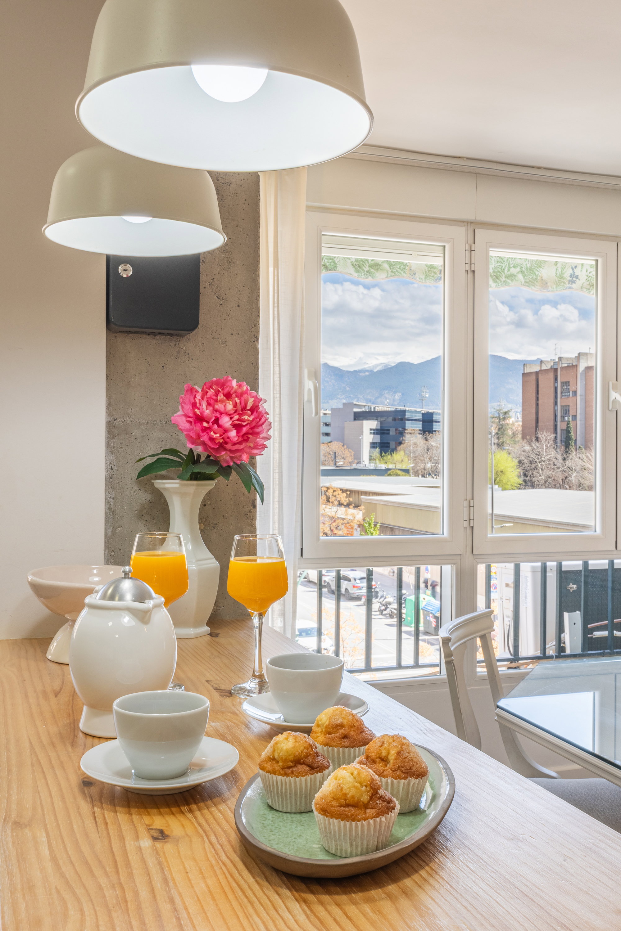dining room with a view of the mountains and a table and chairs.