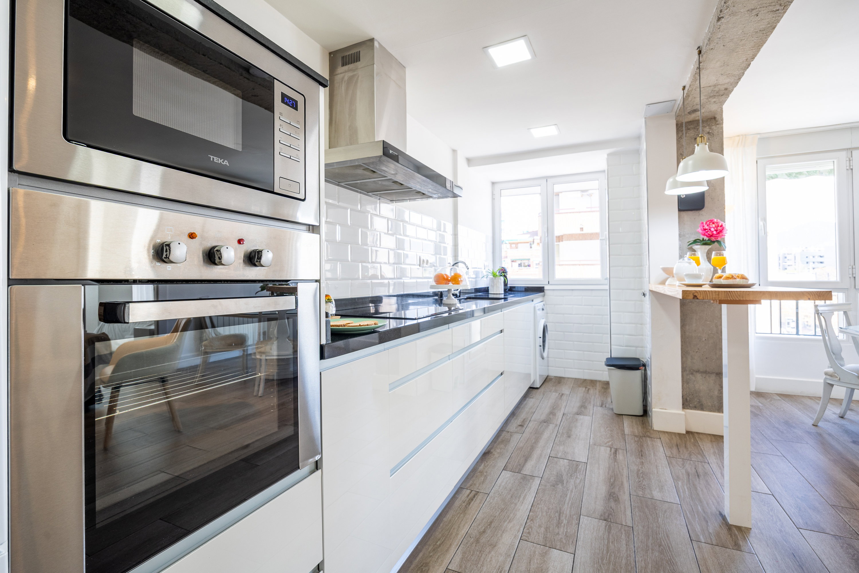 Kitchen equipped with: oven, microwave, hood, induction hob, washing machine, sink