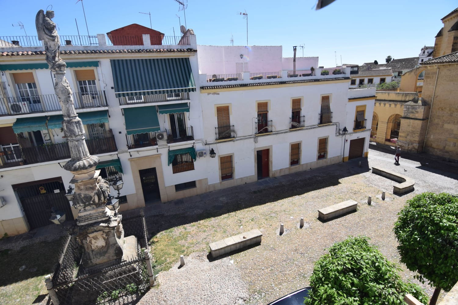 Enjoy scenic views over Plaza de Aguayos, surrounded by classic Andalusian facades and an iconic historic monument.