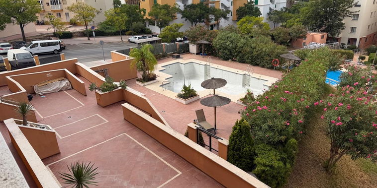 Enjoy views over the sunny terracotta terrace. Lush gardens and local architecture frame the setting.
